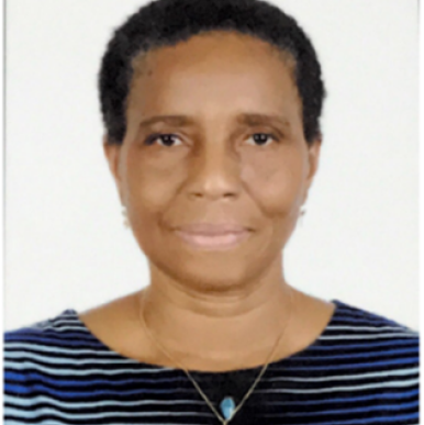 Woman with short, dark hair smiles into the camera