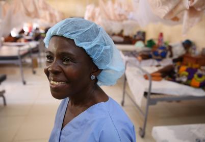 Female nurse in rural hospital with blue nurse clothes on