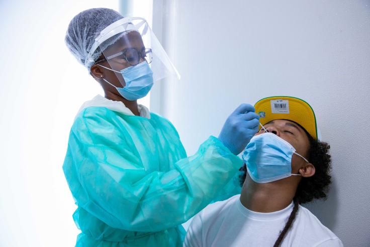 A young man is getting tested against the COVID-19.